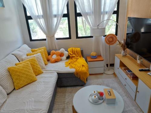 a living room with a couch and a table at Y&S Residence in Olongapo