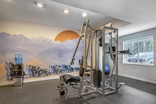 a room with a gym with a painting on the wall at Best Western Plus Pioneer Park Inn in Fairbanks