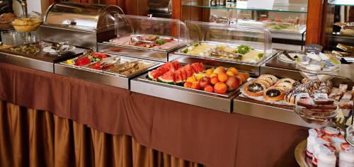 a buffet table filled with different types of food at U Páva in Prague