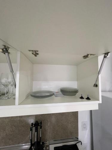 a kitchen with two plates sitting on a counter at Apartment 2 in Apóstoles