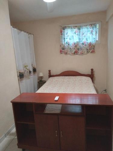 a small bedroom with a bed and a window at ecrin de verdure in Fort-de-France