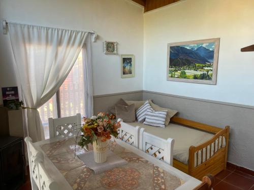 a living room with a table and a couch at Rancho Elquino in Vicuña