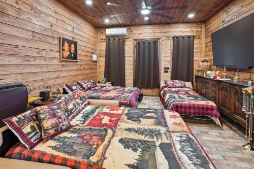 a living room with couches and a flat screen tv at Raka Ranch Barndominium in Folsom