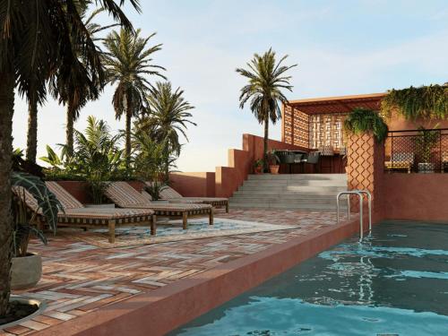 a pool with benches and palm trees next to a house at Deluxe Studio in Secrt Escalante AC in San Pedro