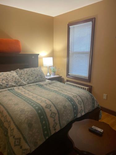 a bedroom with a bed and a window at Private Unit with own Entrance To Share in South Ozone Park