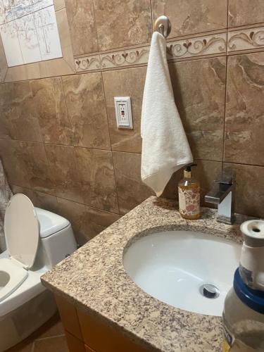 a bathroom with a tub and a toilet and a sink at Private Unit with own Entrance To Share in South Ozone Park
