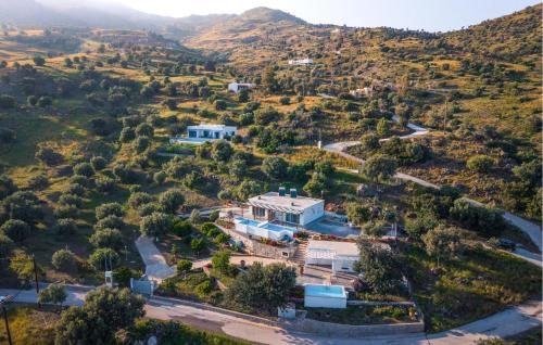 an aerial view of a house in the hills at Prinos 3 in Agia Galini