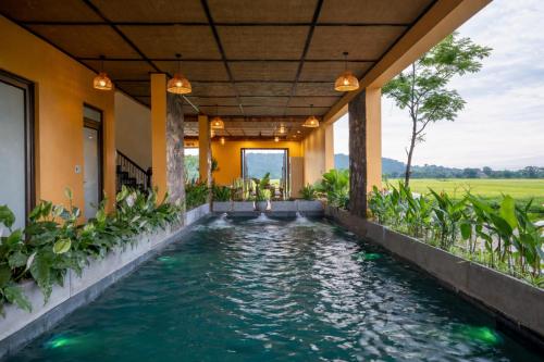 an indoor pool in the middle of a house at Tam Coc Haven House in Ninh Binh