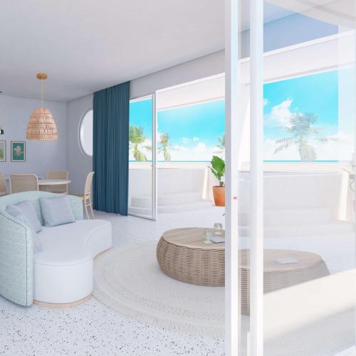 a living room with a view of the ocean at Perla La Paz, Tapestry Collection By Hilton in La Paz