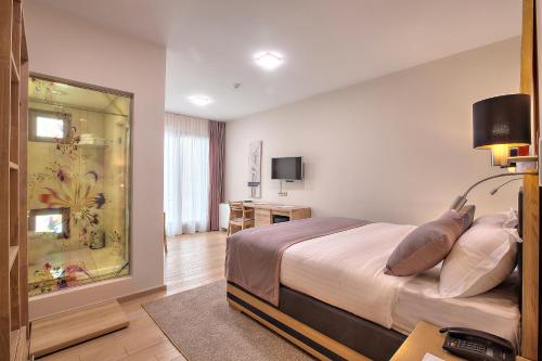 TV o dispositivi per l'intrattenimento presso Hotel Aziza