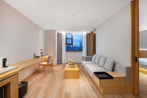 a living room with a couch and a table at 上海天平宾馆 in Shanghai