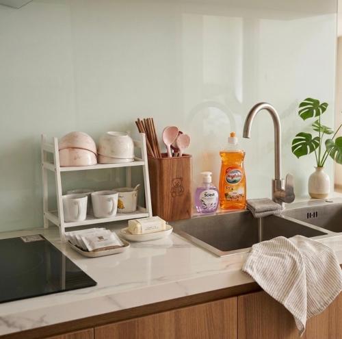 a kitchen counter top with a sink and a sink at Jess Apt in Tuy Hoa