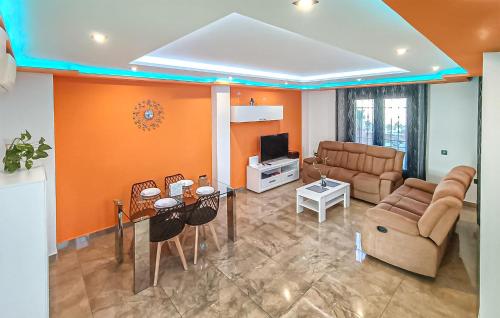 a living room with a couch and a table at Taurus 13 in Jun