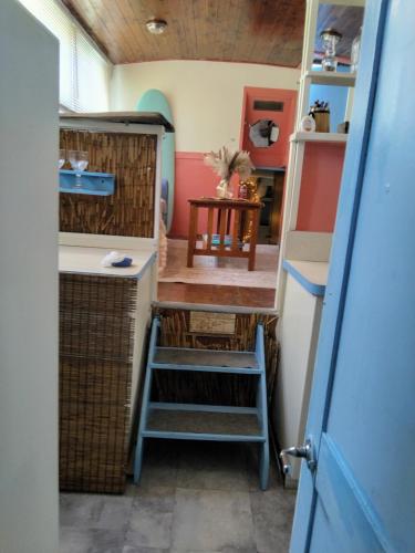 a tiny house with a staircase in a room at party like a local in Key West