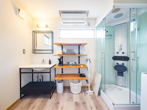 a bathroom with a sink and a shower at Mobile Home 8 in Hokuto