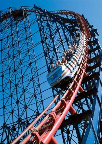 a group of people riding on a roller coaster at The Big Blue Hotel - Blackpool Pleasure Beach in Blackpool