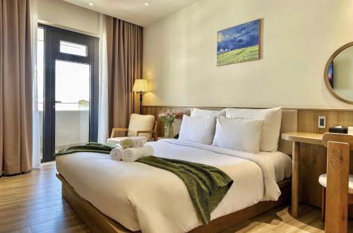 a hotel room with a bed with a teddy bear on it at Túi Ba Gang Central Hotel in Da Lat