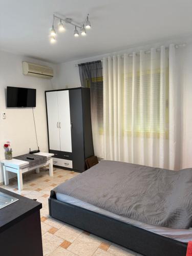 Katil atau katil-katil dalam bilik di Margo Sea View Studio