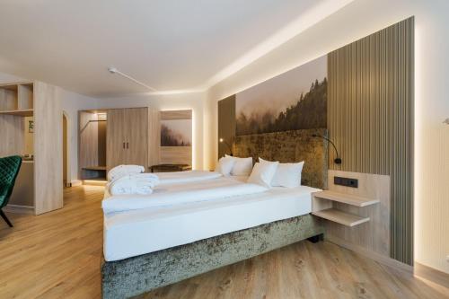 a bedroom with a large bed in a room at Hotel Ritter Badenweiler in Badenweiler