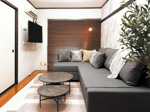 a living room with a couch and a table at #52 Towny Yanagihara in Numazu