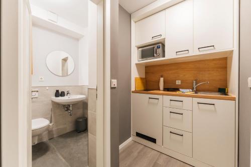 a bathroom with a sink and a toilet at Deich 71 in Borkum
