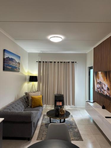 a living room with a couch and a table at Real Kee in Midrand