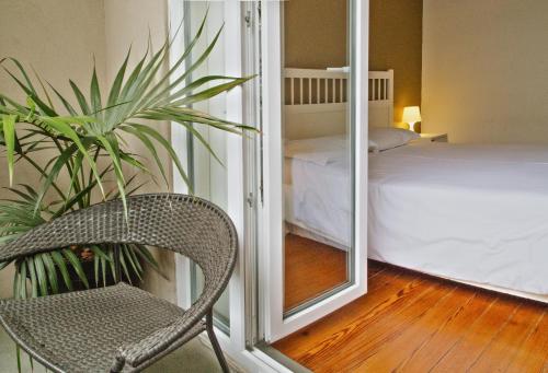 Una cama o camas en una habitación de Porto Spot Hostel