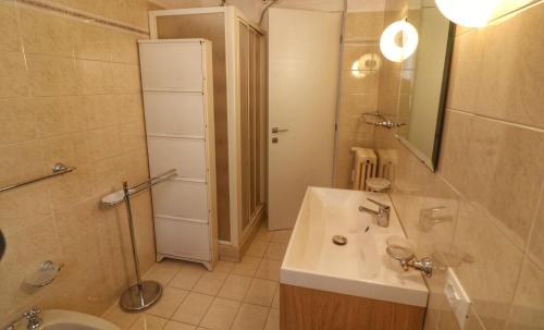 a bathroom with a sink and a toilet and a shower at Al Numero 16 in Levanto