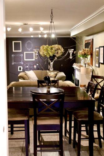 a dining room with a table and a couch at Evergreen Bed & Breakfast in Hope