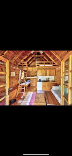 a large room with two bunk beds in it at Una Kamp in Bosanska Krupa