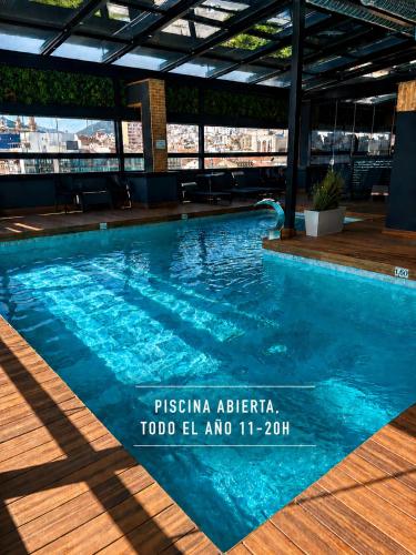 a swimming pool on the roof of a building at Hotel Condestable Iranzo in Jaén
