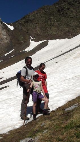 a man and two people standing in the snow at Casa Villamana in Oto