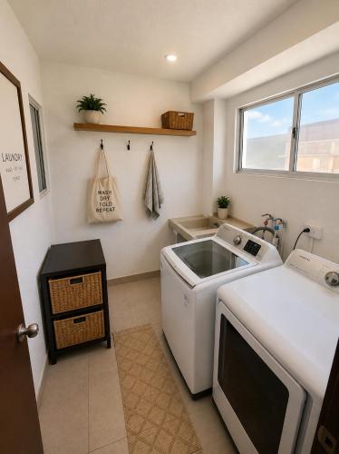 a small kitchen with a sink and a dishwasher at Oceanview house in El Suazal