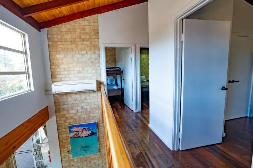 a hallway with a door leading to a living room at Esperance Foreshore Apartments in Esperance