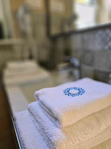a pile of towels sitting on top of a counter at Boutique Resort OSMA - Adults Only in Malinska