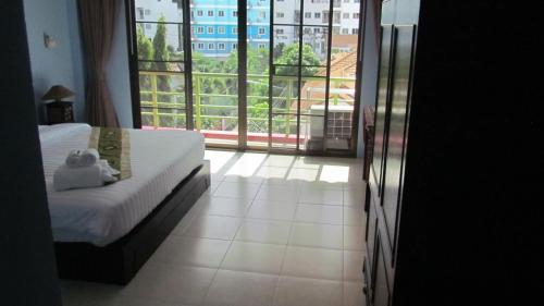 Llit o llits en una habitació de La Piccola Patong