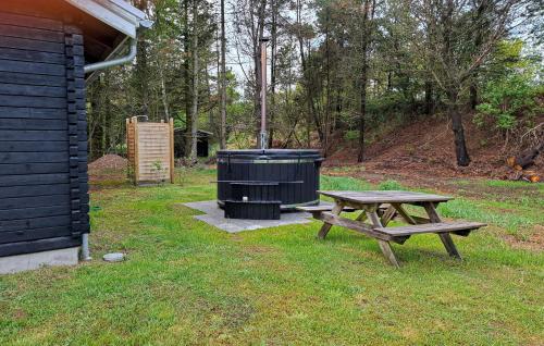 a trash can sitting next to a picnic table at Awesome Home In Hurup Thy With Wifi in Sønder Ydby