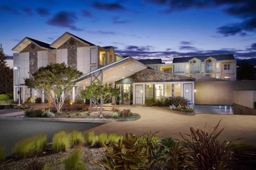 a rendering of a house at night at Corporate Inn Sunnyvale - All-Suite Hotel in Sunnyvale