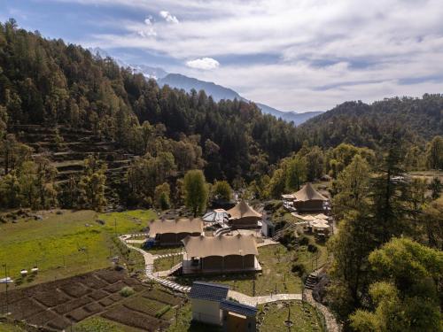 an aerial view of a village in the mountains at Saraaya Glamps, Dharamshala in Dharamshala