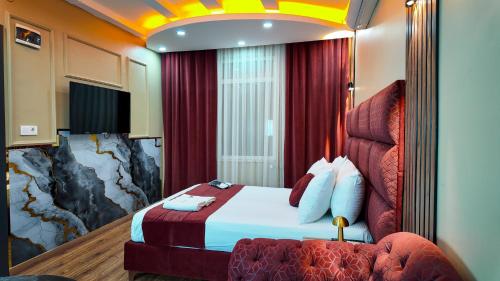 a hotel room with a bed and a couch at Viva Rooms in Istanbul