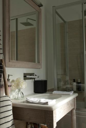 a bathroom with a sink and a mirror at Chrysalis Nature Villa 3 in Kampos Paros