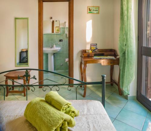 a bathroom with a bed and a shower and a sink at B&b La Giara in Maratea