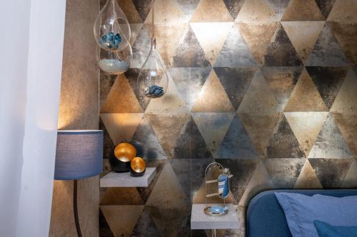 a room with a stone wall with a wall at La Chambre Loft in Hennebont