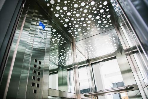 a building with a glass ceiling and a window at Apart Hotel Petit Palace Suites in Lima