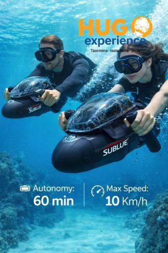 two people in the water with a turtle on a raft at Hugo Experience - Taormina boat tour in Taormina