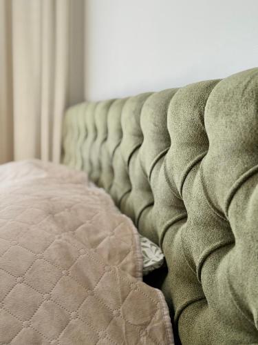 a close up of a mattress on a couch at DEUX rooms in Liepāja