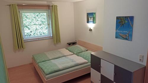 a small room with a couch and a window at Villa Rupi in Sankt Ulrich am Pillersee