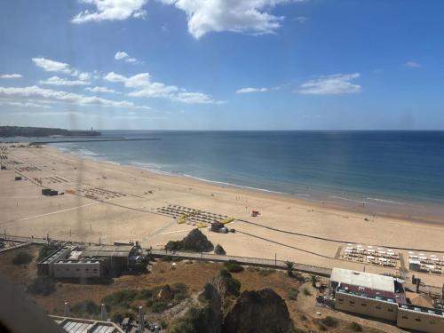 a view of a beach and the ocean at Rocha Atlantico in Portimão