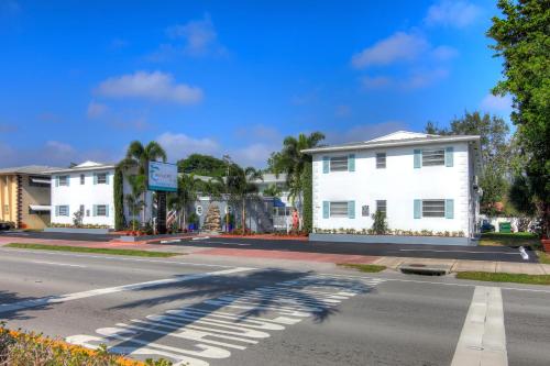 an intersection of a street with a white building at May-Dee Suites in Florida in Hollywood