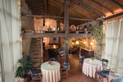 a room with two tables and chairs in a building at Caserio Iruaritz in Amurrio